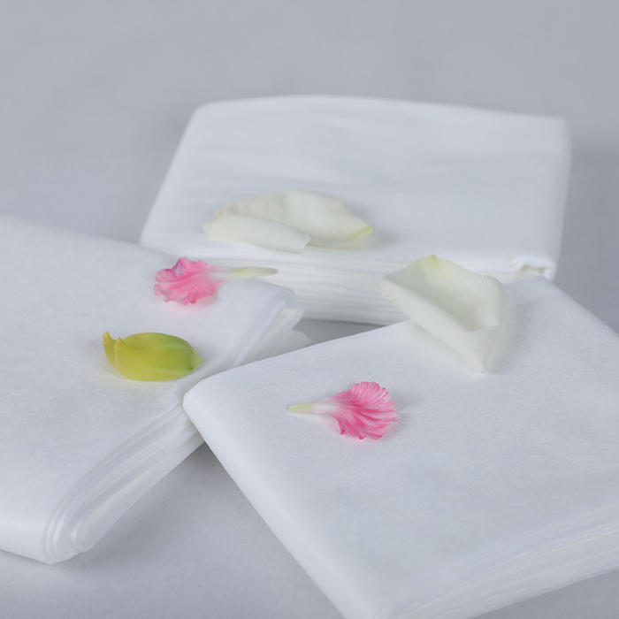 What is the manufacturing process for nonwoven disposable bath towels?